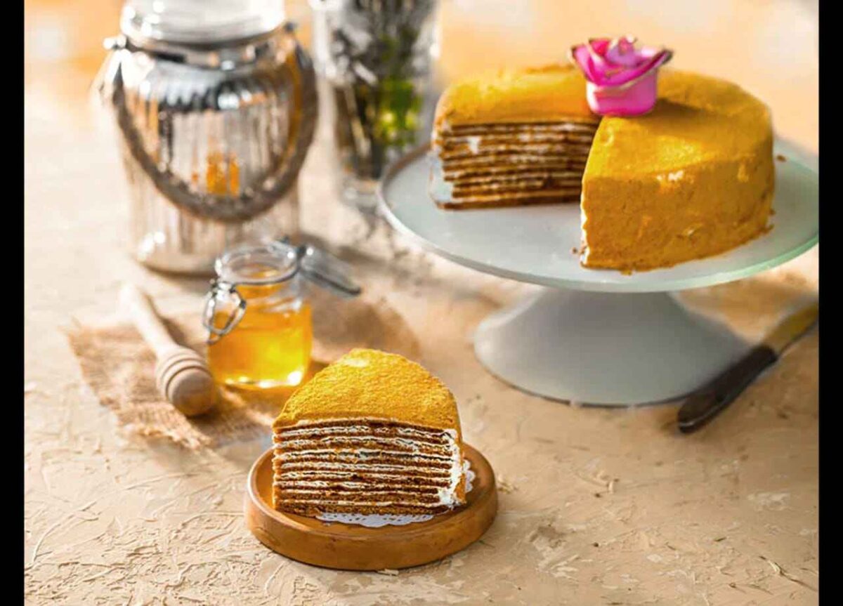 WhatsApp-Image-2025-09-25-at-12.58.35-PM_15_11zon Layered honey cake slice with cream filling