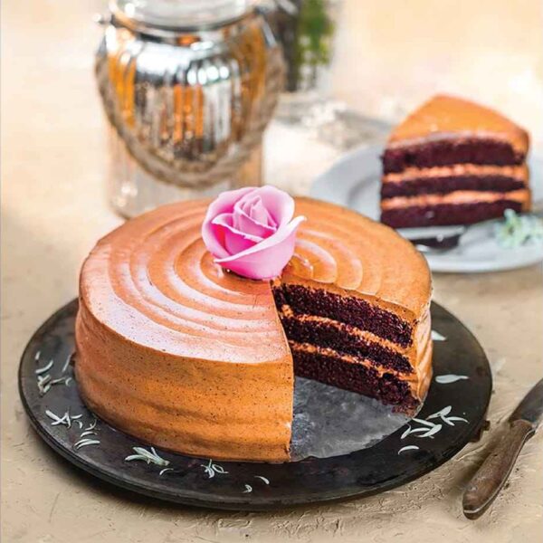 Chocolate cake with pink rose on top